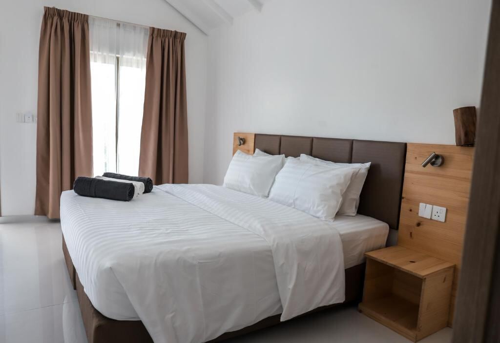 Deluxe Room - king bed and garden-facing window